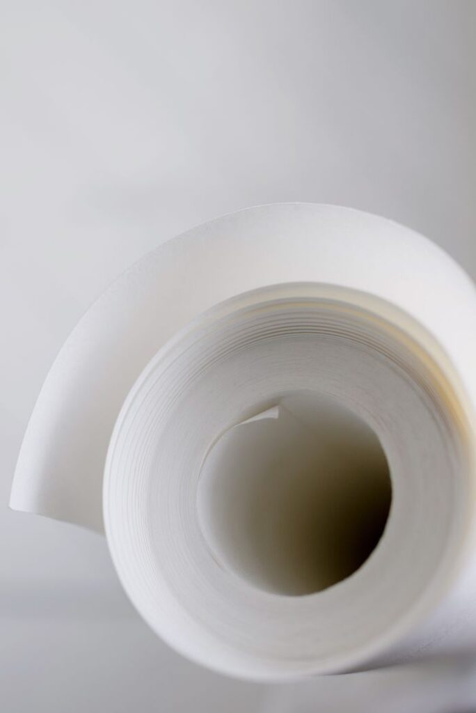 Closeup of white masking tape for repairing work against white background at home